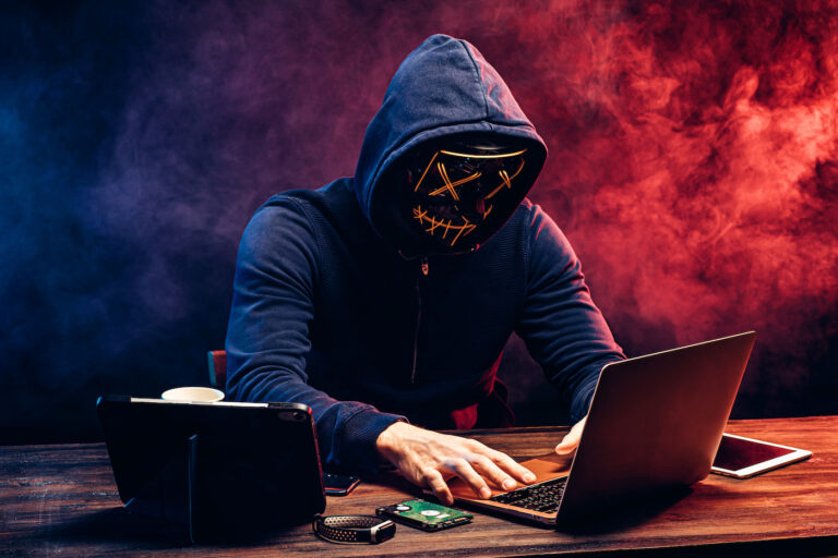 hacker man typing on laptop, hacking computer system