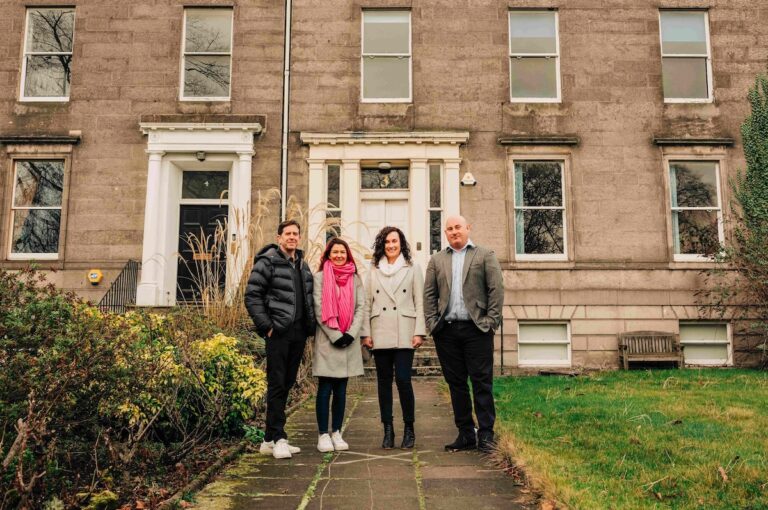 Nick and Caroline Claydon from Archibald Marckay Group pictured outside 3 John’s Place in Leith alongside Lucie Martin and Brian Machray from Reward Finance Group.