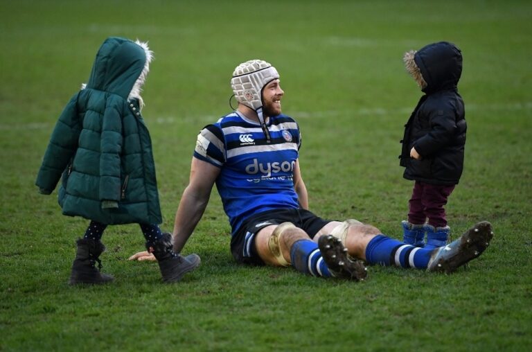 DAVE ATTWOOD with his children Jess & Patch on the playing filed at Bath Rugby.